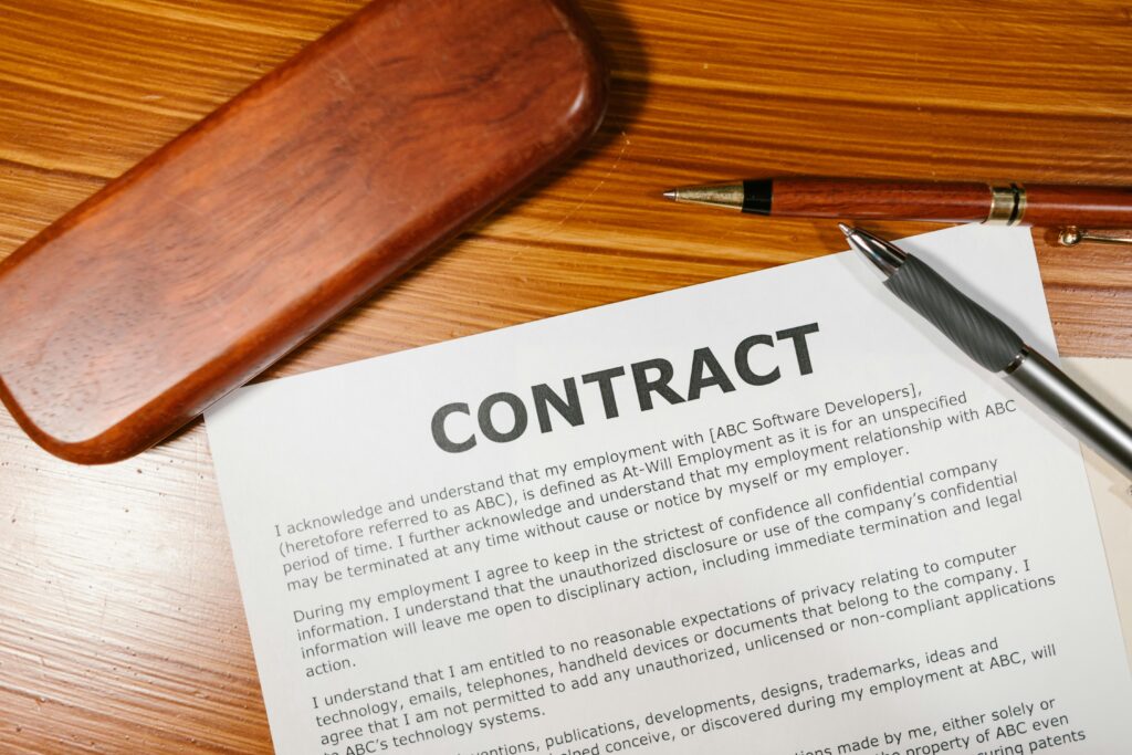 A contract on brown wooden surface